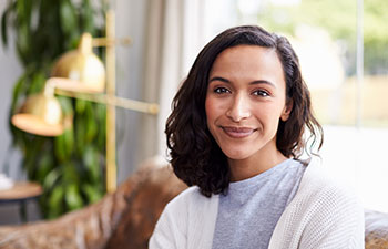 Young mixed race woman in a cafe.