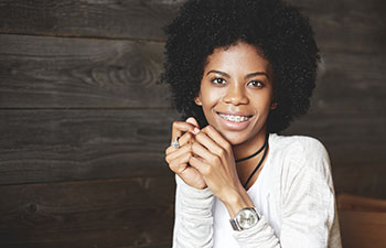 Attractice Afro-american woman wearing braces.