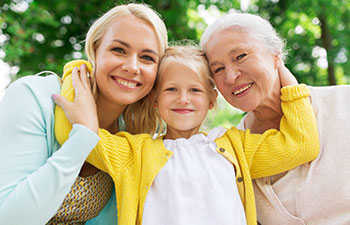 A schoolgirl with her mother and grandmother.