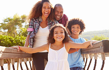 Happy Afro-American family of four.