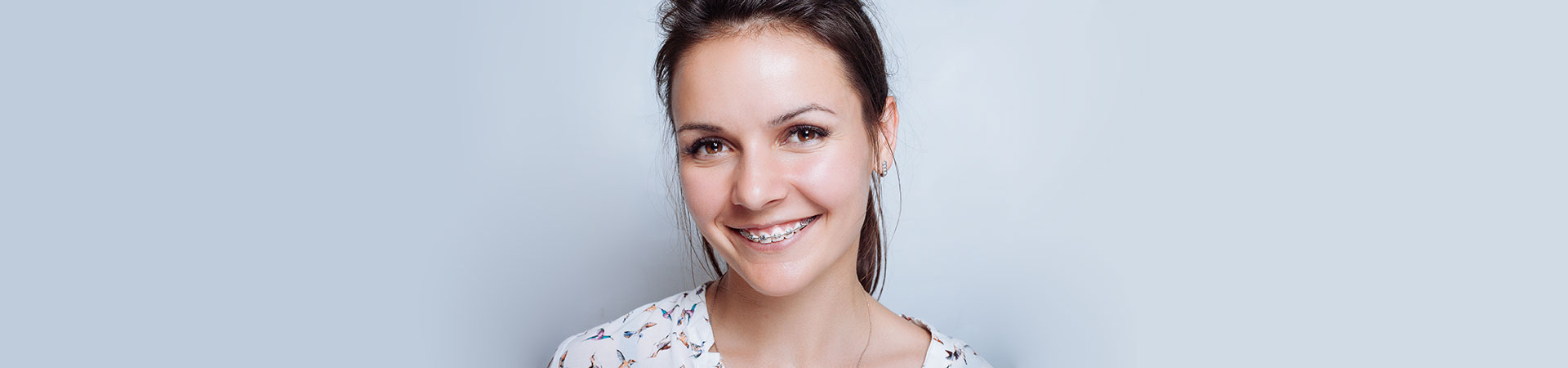 Adult woman wearing orthodontic braces.