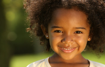 happy girl with curly hair